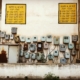 abandoned electricity meter boxes on a wall of old building